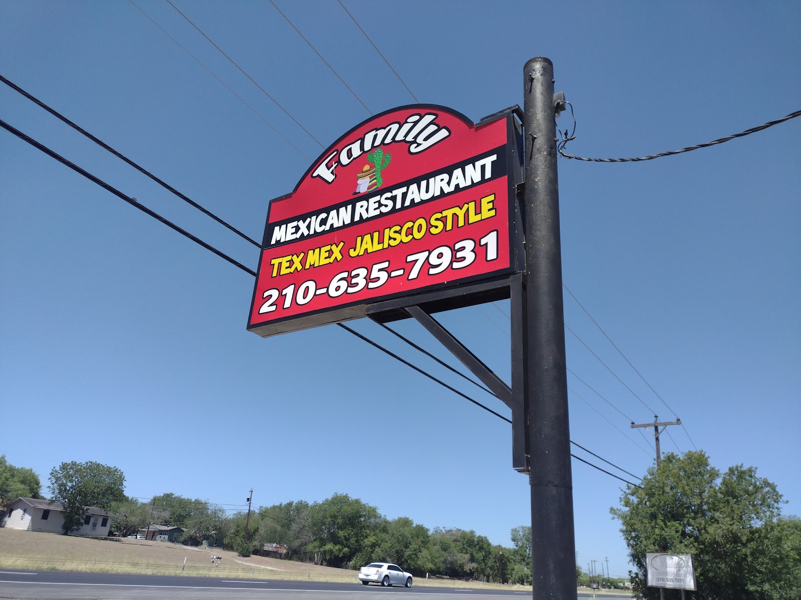 Family Mexican Restaurant road sign reading Tex Mex Jalisco Style